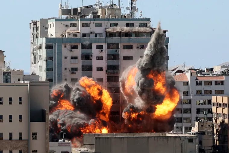 A ball of fire erupts from a building housing various international media, including The Associated Press, after an Israeli airstrike on Saturday, May 15, 2021 in Gaza City.   The attack came roughly an hour after the Israeli military ordered people to evacuate the building, which also housed Al-Jazeera and a number of offices and apartments. There was no immediate explanation for why the building was targeted.