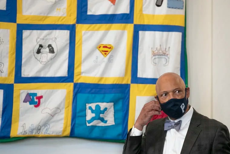 William R. Hite Jr., superintendent of the School District of Philadelphia, stands next to quilt of artwork by students after a news conference about plans for reopening in the fall at Spring Garden Elementary in Philadelphia on May 19, 2021.