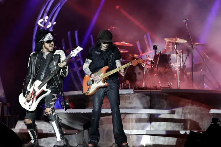Mötley Crüe’s Nikki Sixx (left), Mick Mars and Tommy Lee (right) perform during their Stadium Tour 2022 concert at Citizens Bank Park in Philadelphia on Saturday.