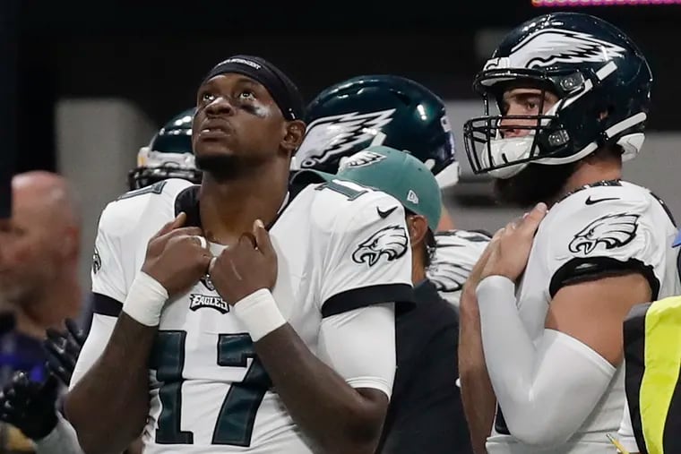 Eagles wide receiver Alshon Jeffery and tight end Dallas Goedert, both sidelined with calf injuries, follow the action as their teammates lose to the Atlanta Falcons on Sunday, September 15, 2019 in Atlanta.