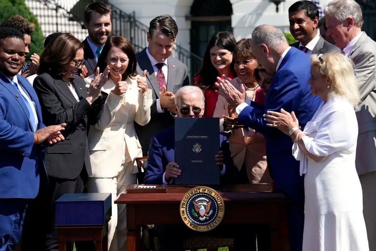 President Joe Biden signs the CHIPS and Science Act into law on Tuesday.