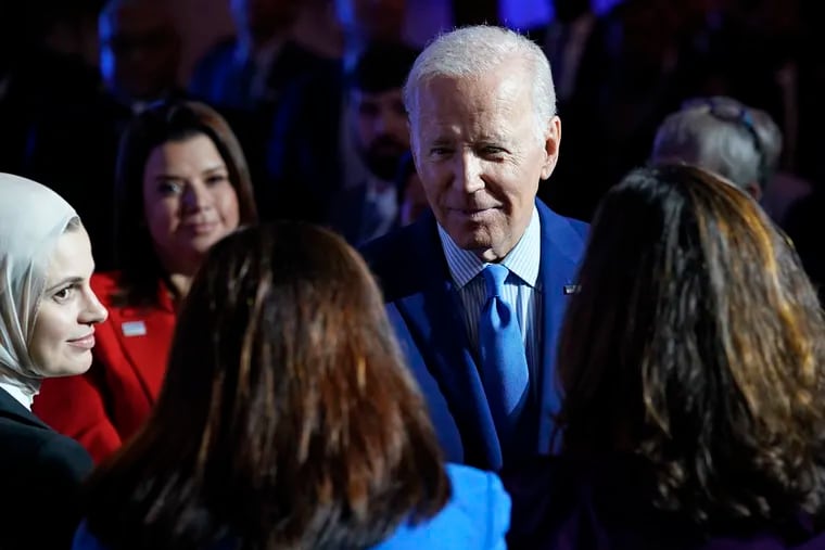 President Joe Biden greets people after speaking at the United We Stand Summit in the East Room of the White House in Washington on Thursday.