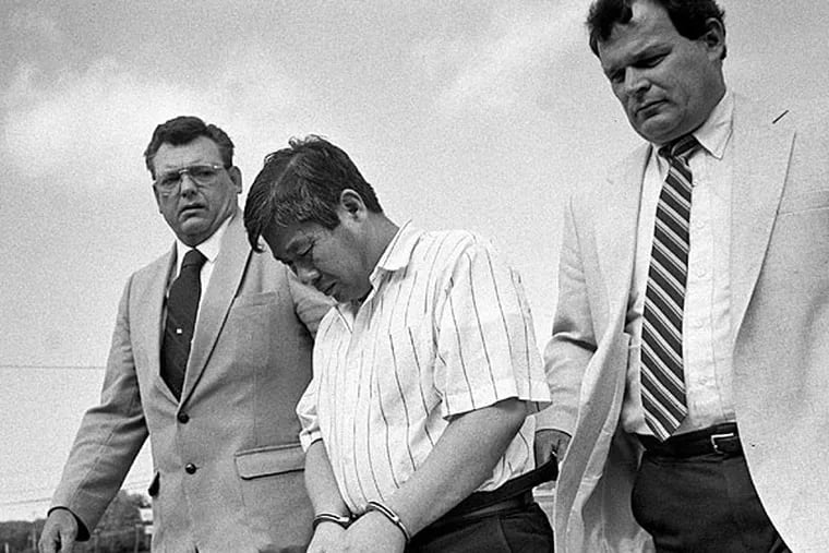 Han Tak Lee with State Police Fire Marshal Thomas Jones (right) and Stroud Township Police Investigator Vernon Bortz in September 1989. Lee is serving a life sentence for murder and arson. (David W. Coulter/The Pocono Record/File)