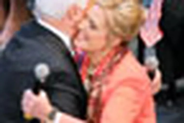 Ann Romney is greeted by Governor Tom Corbett after her introduction at Elizabethtown College Monday, Oct. 15, 2012. (AP Photo/Intelligencer Journal, Dan Marschka)