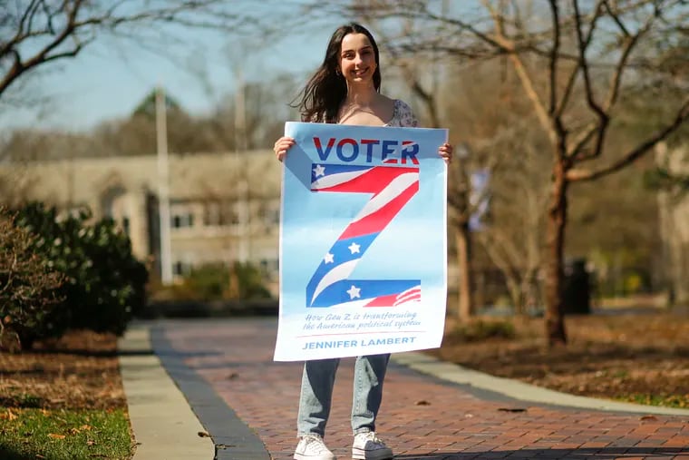 Jennifer Lambert, a junior political science major at Villanova, holds a copy of the cover of her upcoming book, "Voter Z." She interviewed more than two dozen members of Generation Z across the country about their political beliefs, their voting habits, and the politicians who inspired them.