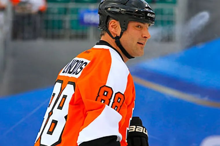 "It was just great to get back out there," Eric Lindros said after Thursday's skate. (Tom Mihalek/AP file photo)