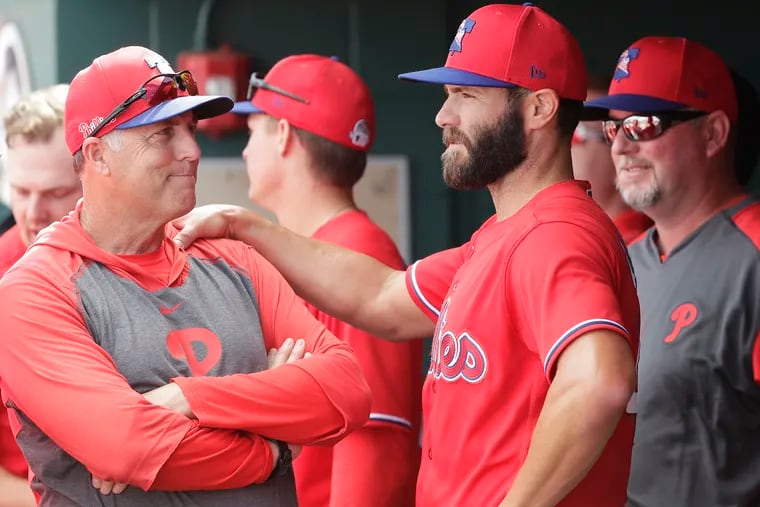 Phillies pitching coach Bryan Price, left, was absent from Saturday's game at Citizens Bank Park.