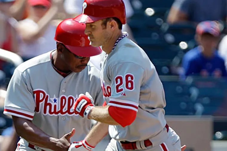 Chase Utley hit a two-run home run in the seventh inning to set up the Phillies' win over the Mets. (Kathy Willens/AP Photo)