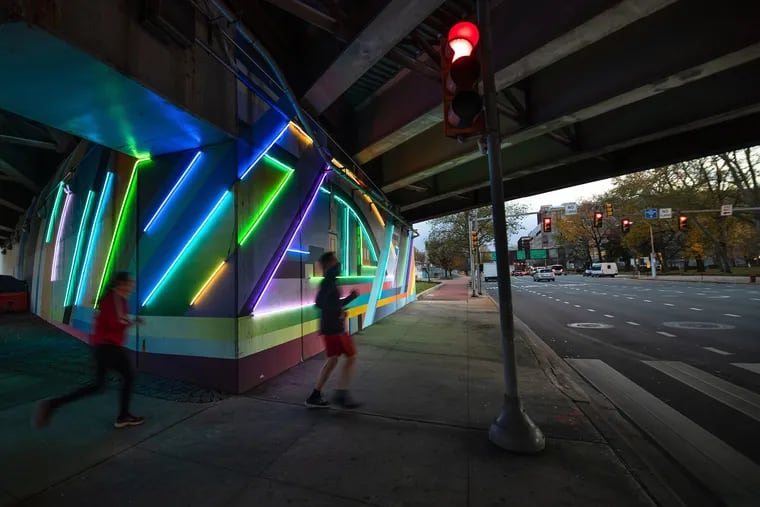 "Electric Philadelphia," a mural and light installation from the Mural Arts Program, is being dedicated Wednesday in conjunction with Arts and Culture Recovery Week. The 8,500-square-foot mural fills the underpass adjacent to Franklin Square.
