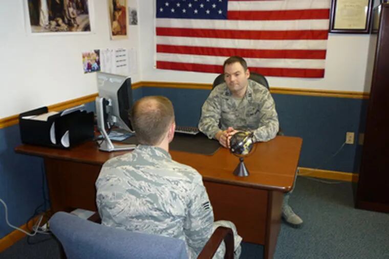Air Force Capt. Scott Brill (right), chaplain at Joint Base McGuire-Dix-Lakehurst, talks with a senior airman. (Edward Colimore / Staff)