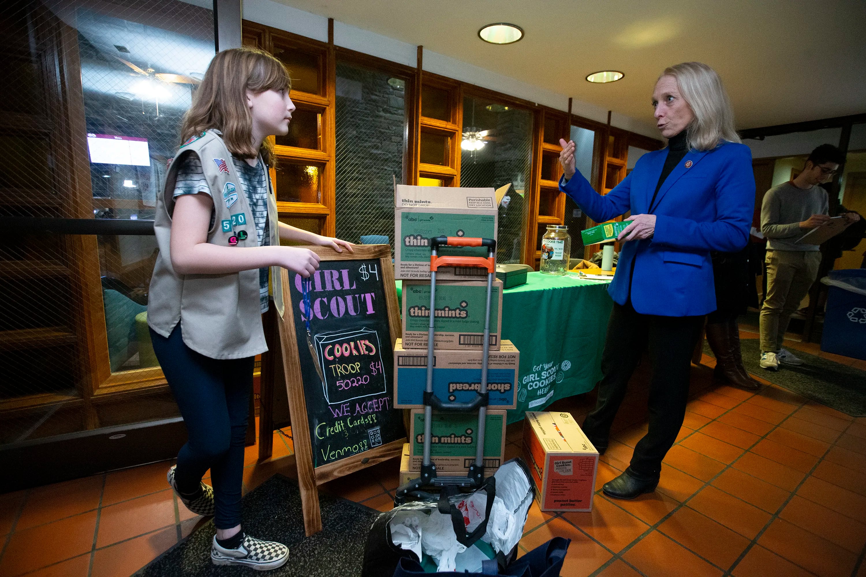 Rep. Mary Gay Scanlon (D., Pa.) talks to Girl Scout Lauren Davis, as she unloads her Girl Scout cookies at the entrance to the Swarthmore College Dining Hall on Jan. 31, 2020.