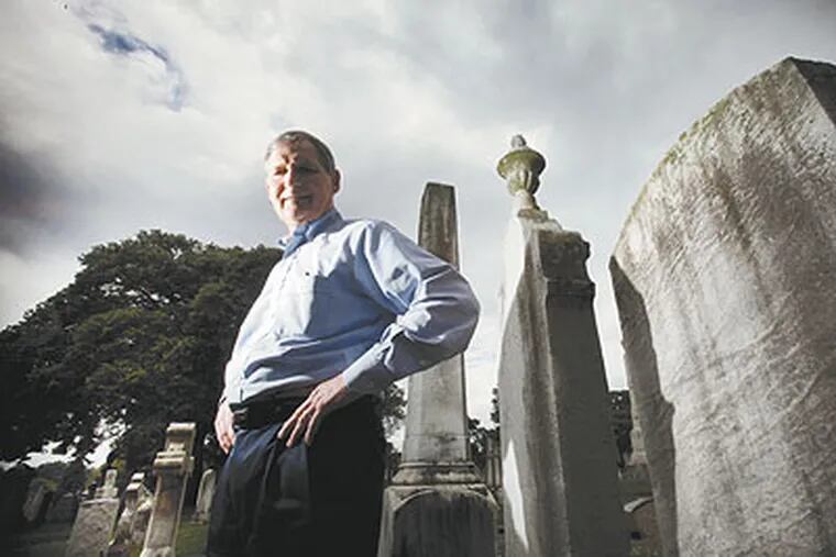 Among the graves at Laurel Hill Cemetery is CEO Pete Hoskins. But his main concern is for left-behind animals, including those at the zoo, which he ran for years. (Laurence Kesterson / Staff Photographer)