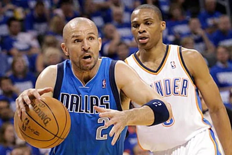 Mavericks point guard Jason Kidd gets the ball past the Thunder's Russell Westbrook during Game 3. (Sue Ogrocki/AP Photo)