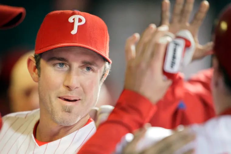 Phils Chase Utley (left) congratulates a teammate during the Houston at Phillies game on Oct. 1, 2009. ( ( Elizabeth Robertson / Staff Photographer ) EDITORS NOTE:: PHILS02 112574 Houston at Phillies,
