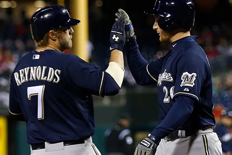 The Brewers' Mark Reynolds celebrates his two-run homer. (Yong Kim/Staff Photographer)