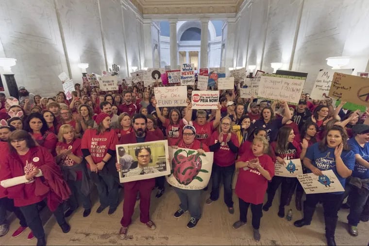 Thousands of teachers and school personnel descended on the state Capital to demonstrate at the Capitol building on the second day of the teacher walkout in Charleston, W.V., on Friday.