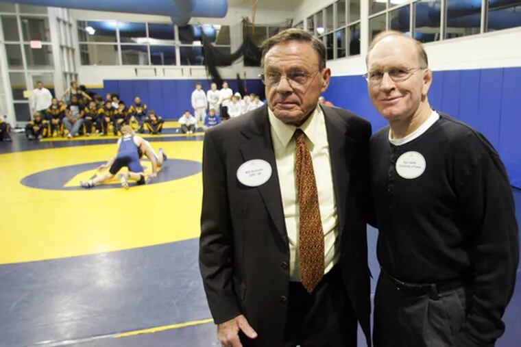 Wrestling benefactor Bill Graham IV (left) and Olympian Dan Gable attend Wrestling Appreciation Day at Penn Charter. Along with the festivities, the Quakers competed against Conwell-Egan.