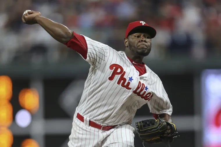 Hector Neris pitched a perfect seventh inning in his first game since being recalled from triple A.