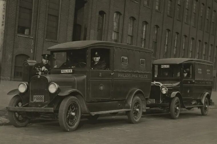 Philadelphia police and patrol wagons, circa 1935.