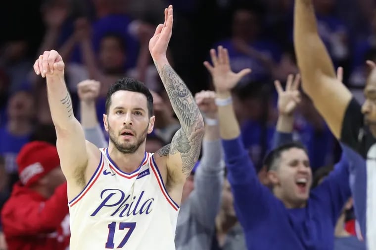 JJ Redick of the Sixers celebrates after hitting a 3-pointer with 1:34 left to go in their game against the Cavaliers during the 4th quarter at the Wells Fargo Center on April 6, 2018.