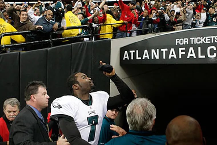 Michael Vick was greeted with a mixture of cheers and boos by fans in Atlanta, even when he scored a touchdown on a quarterback draw on the first drive of the third quarter. (Ron Cortes/Staff Photographer)