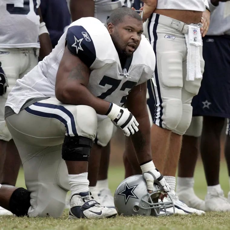 Dallas Cowboys lineman Larry Allen taking a knee during training camp on Aug. 1, 2005, in Oxnard, Calif.