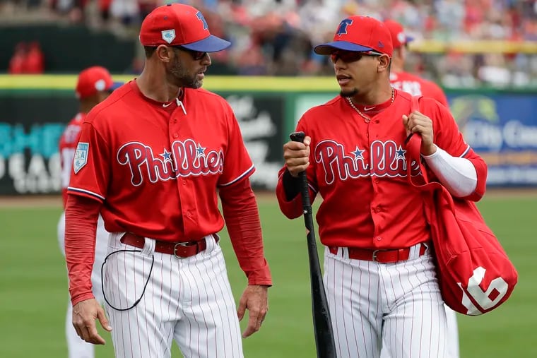 Second baseman Cesar Hernandez (right) and manager Gabe Kapler walking to the Phillies dugout during spring training.