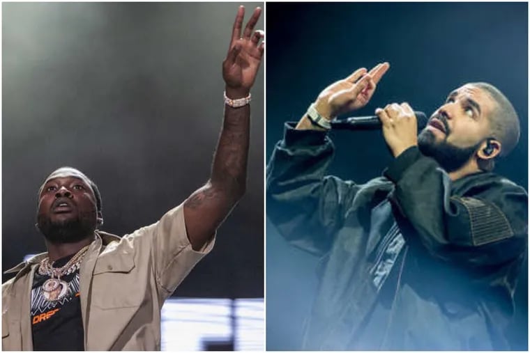 Meek Mill, at left, was brought on stage by Drake, at right, for a guest performance Saturday night at the Wells Fargo Center during Drake's Aubrey & The Three Migos tour.