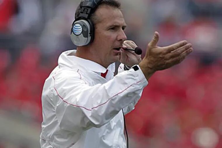 Urban Meyer's Buckeyes are 4-0 on the season and ranked 14th in the AP Top 25. (Jay LaPrete/AP)