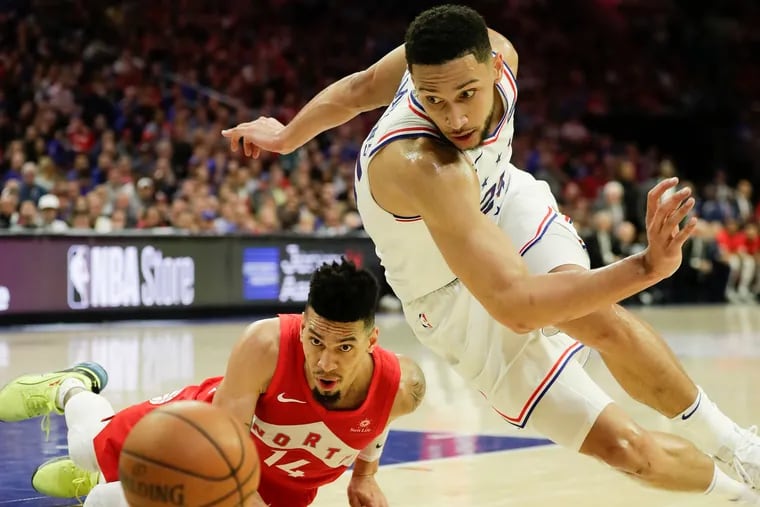 Ben Simmons, who scored 21 points, beats Raptors’ Danny Green to a loose ball in Thursday’s Game 6.The series is tied 3-3.