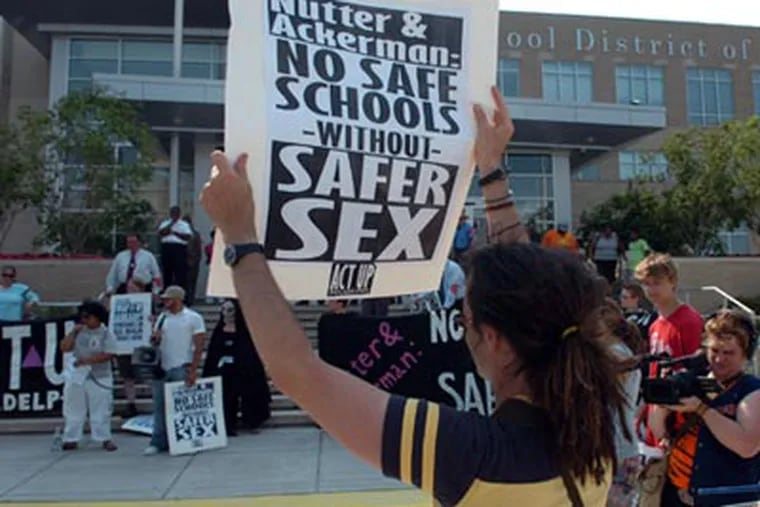 Safe-sex activists held a rally yesterday in front of the Phila. School District headquarters calling for free condom distribution in all area public high schools.