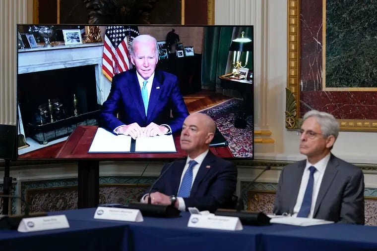 Homeland Security Secretary Alejandro Mayorkas and Attorney General Merrick Garland, right, listen as President Joe Biden speaks virtually during the first meeting of the interagency Task Force on Reproductive Healthcare Access in the Indian Treaty Room in the Eisenhower Executive Office Building on the White House Campus in Washington, on Wednesday.