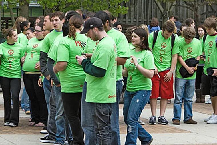 File photo: Rowan University students gather to form a human ribbon in support of the 2010 Organ Donor Day. (David M Warren / Staff Photographer)