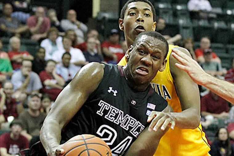 Temple forward Lavoy Allen (24) fights for the ball with  California forward Richard Solomom. Temple lost, 57-50.  (AP Photo/Reinhold Matay)