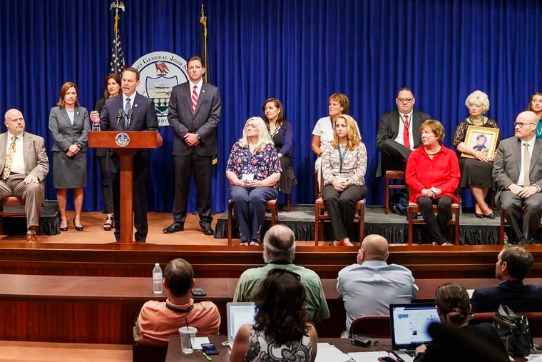 Pennsylvania Attorney General Josh Shapiro, center, speaks on the findings of the grand jury report on child sexual abuse in six Catholic Dioceses in Pennsylvania at the State Capital on Aug. 14, 2018. The names of the clergy will remain shielded, the Pennsylvania Supreme Court ruled.
