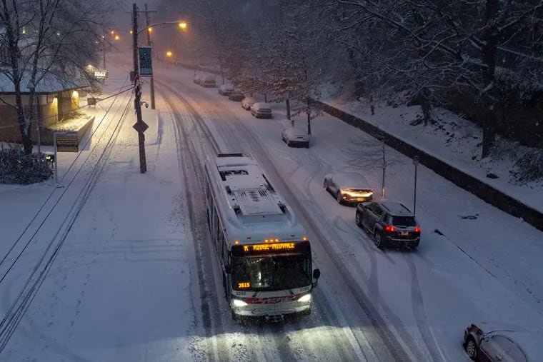 The Route K SEPTA bus takes it slow along the hilly section of Midvale Avenue in the East Falls section of Philadelphia during this week's snow.