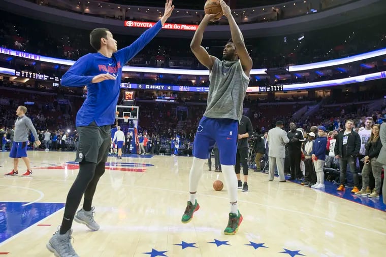 Joel Embiid, right, will miss his sixth straight game on Tuesday.