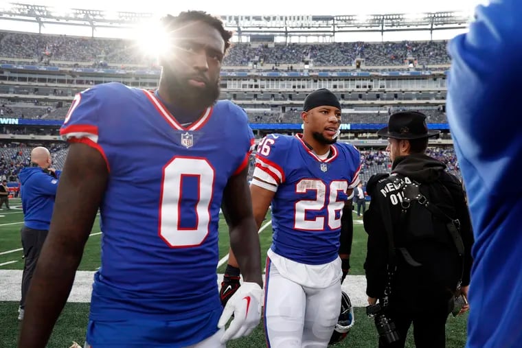 Parris Campbell (0 )and Saquon Barkley of the New York Giants after a game against the Washington Commanders on Oct. 22. Both players are with the Eagles now.