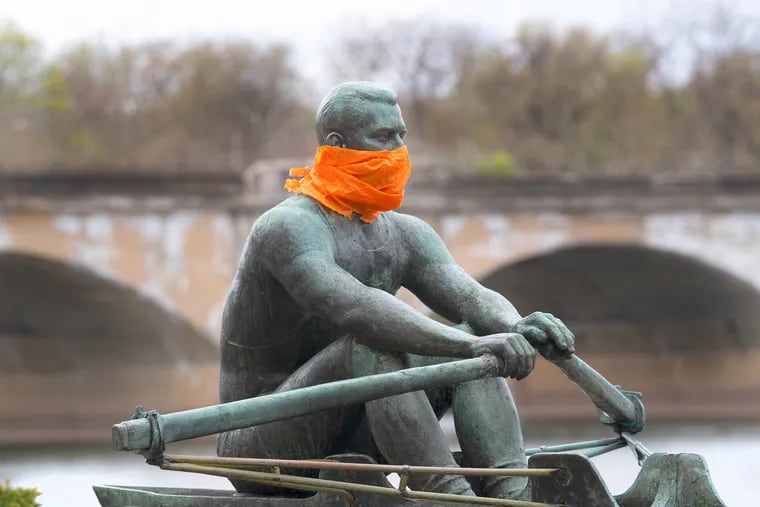 Along Kelly Drive in East Fairmount Park, the statue of Philadelphian and Olympic rowing champion John B. Kelly was adorned with a face mask -- like many city residents, who are following recommendations to wear masks if they leave the house during the coronavirus pandemic.