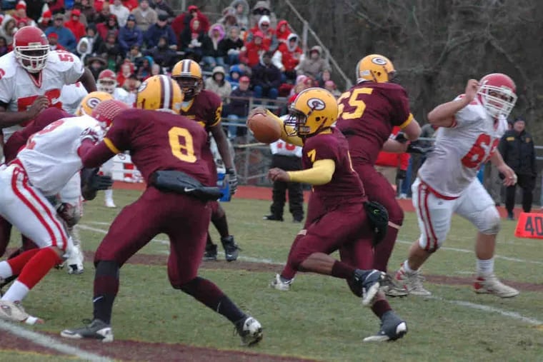 Glassboro quarterback Stephen Clement scrambles away from the Paulsboro pass rush. Clement almost missed the seasonwith meningitis, but he was cleared to play by the time of the team's opener in September.