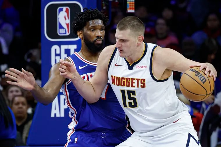 Sixers Joel Embiid guards Nuggets Nikola Jokic during the 1st quarter at the Wells Fargo Center in Philadelphia, Tuesday, January  16, 2024.