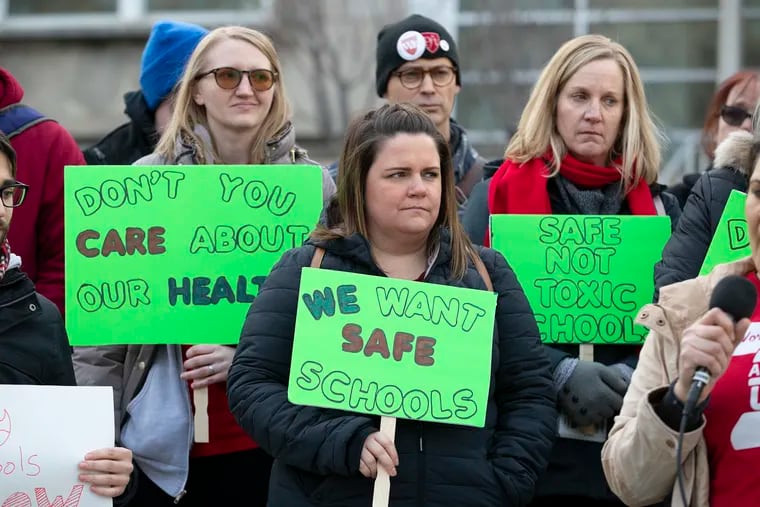 School teachers from Franklin Learning Center, McClure Elementary, and Elkin Elementary rallied outside of the School Distict of Philadelphia’s offices on Thursday to protest asbestos issues in their schools.