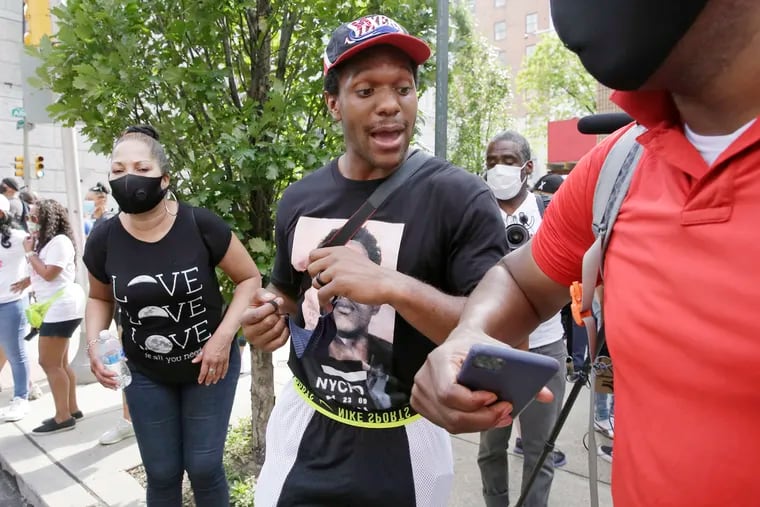 Eagles safety Rodney McLeod (center) attended a march for equality and justice in June that ended at the African American Museum at 7th and Arch Streets.