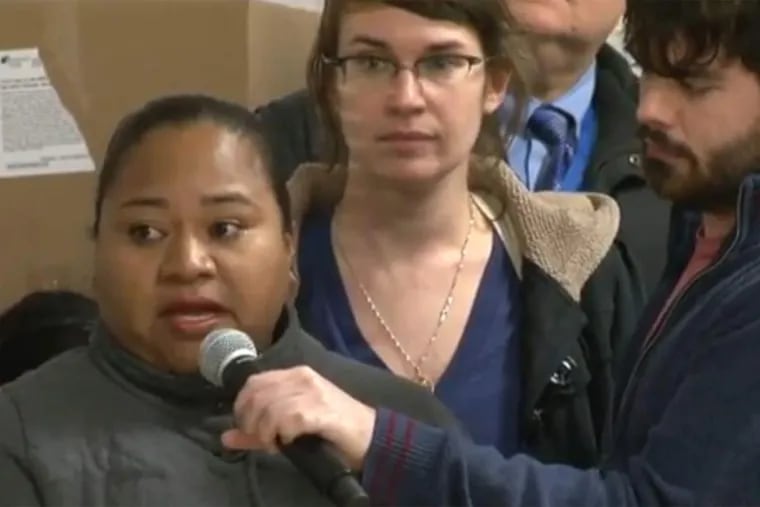 Screen shot from video recorded at Mayor-Elect Kenney's Philadelphia Neighborhood Town Hall, Dec. 3, 2015 at Mayfair Community Center in which Estela Hernandez spoke. The young woman translating is Nicole Scharf
Kligerman, community organizer for the New Sanctuary Movement.