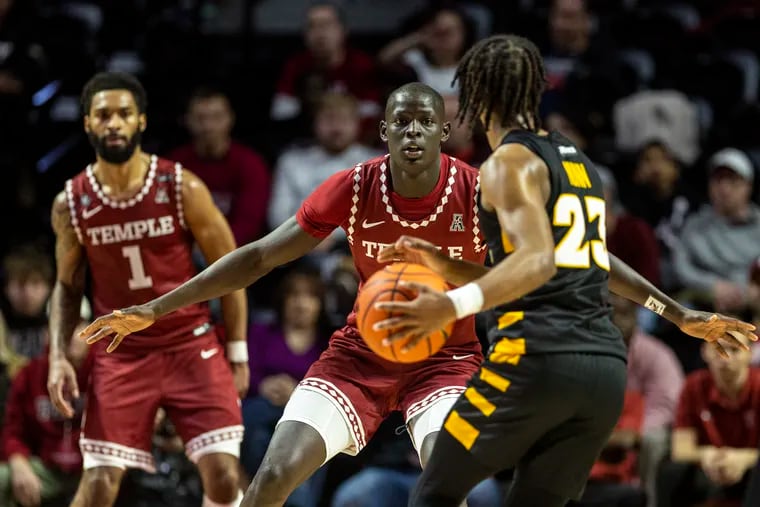 Temple's Kur Jongkuch (center) landed in Philly after his family fled South Sudan and started a new life in Canada. He found a love for basketball, along with a chance at a college career.