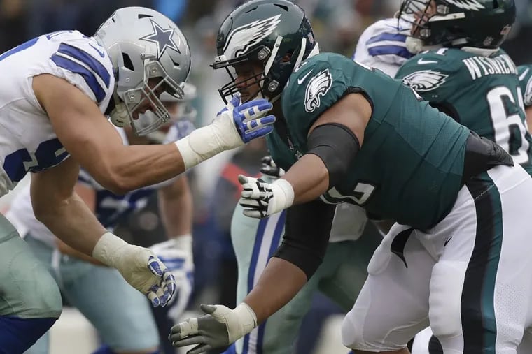 Eagles offensive tackle Halapoulivaati Vaitai blocks Dallas Cowboys defensive end Tyrone Crawford on Sunday, December 31, 2017 in Philadelphia. YONG KIM / Staff Photographer