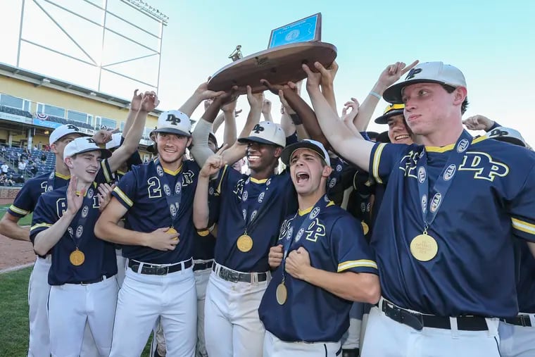 Devon Prep celebrates with the State Championship trophy after beating Serra Catholic 3-2 for the PIAA Class 2A state Championship at Medlar Field in State College.   Friday, June 14, 2019