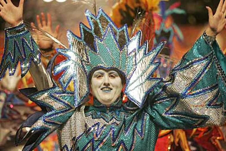 A dancer with the Golden Crown Fancy Brigade performs "Fire and Ice" in the 2007 parade. (Michael Bryant / Staff Photographer)