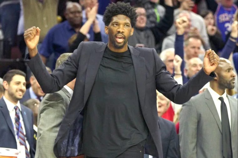 Sixers’ big man Joel Embiid watches during the final moments of his team’s win over the Cavaliers on Friday.