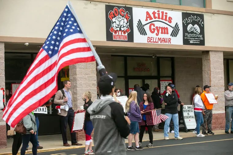 Supporters of Atilis Gym and their right to reopen and anti-Gov. Phil Murphy protesters gather outside the gym at 363 W. Browning Rd.,
Bellmawr, N.J., on Monday morning, May 18, 2020.